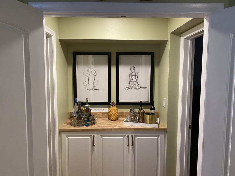 Bar area. The outer double doors close to the master bed/bath creating access. 