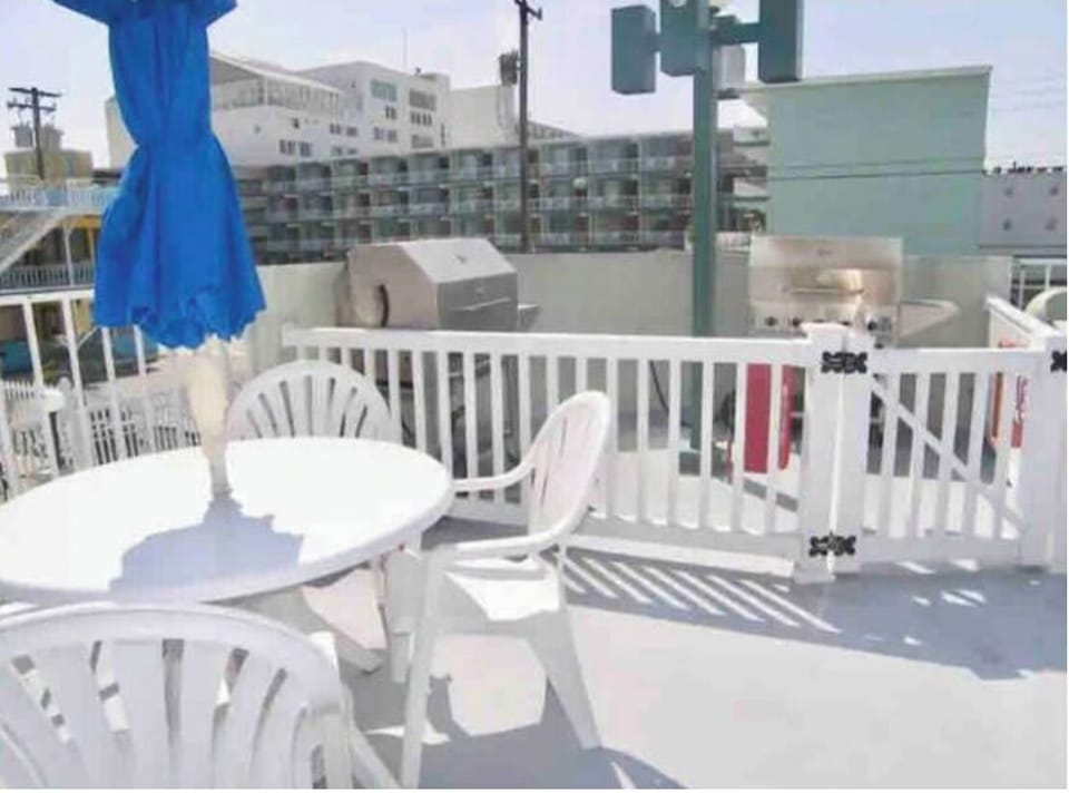 Plenty of tables by the pool and 2 gas grills. 