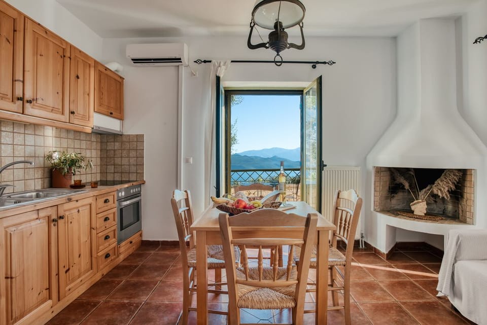 Ground floor with living area, kitchen, dining table, WC w/washing machine.
