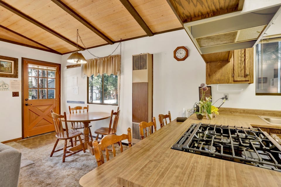 Fully equipped cabin kitchen with ample cabinetry, stove, fridge, microwave, and coffee maker—perfect for cooking meals, morning coffee, and feeling right at home on your stay.