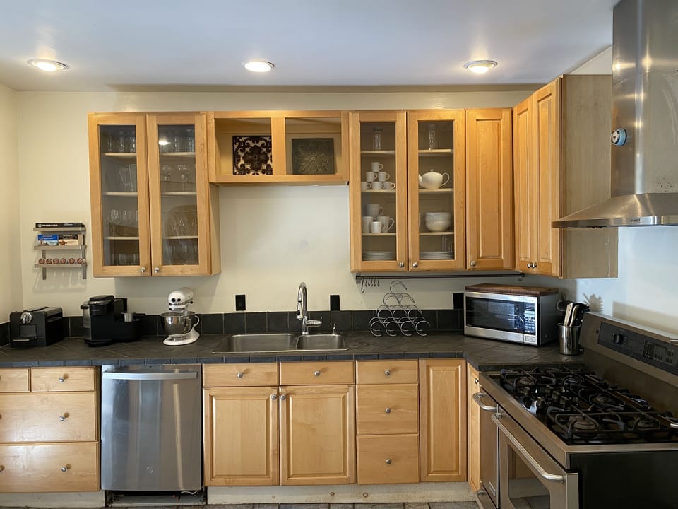 Our Chef's Kitchen has stainless steel appliances, cooking and dining utensils.