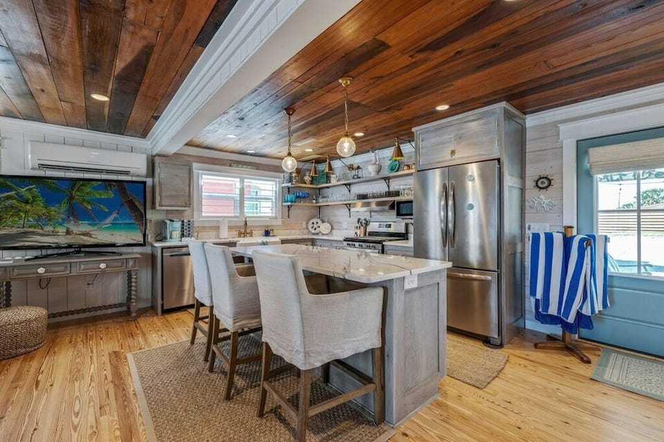 New stainless appliances including an icemaker in the fridge.