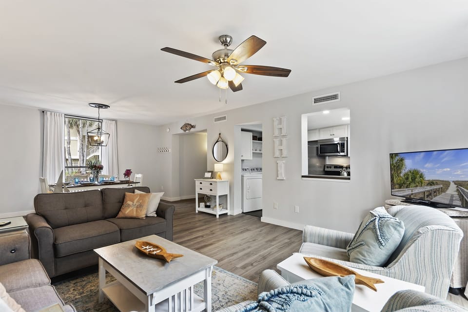 Plenty of seating in the living room invites family movie nights or board game fun with guests. Everyone can relax and enjoy quality time together.