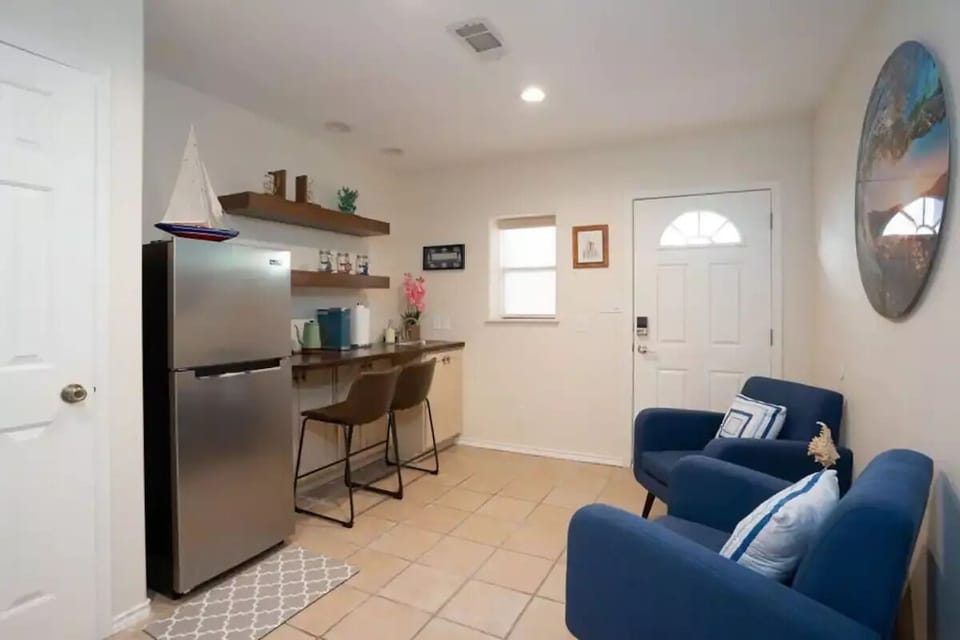 Cozy lounge with kitchenette & comfy chairs—a relaxing nautical retreat