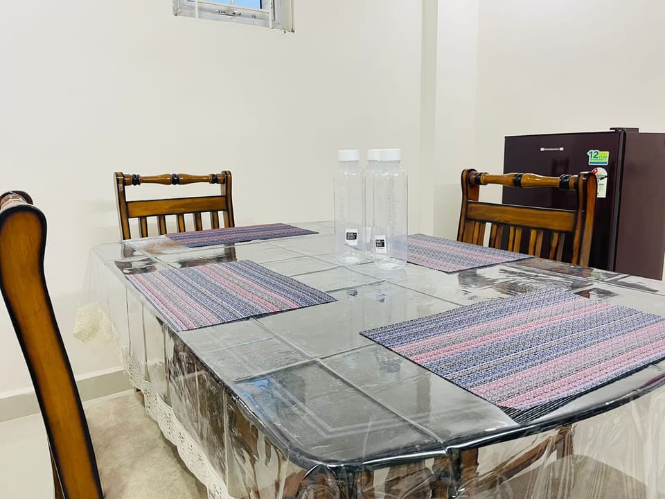 Dining table and Fridge in Dining room