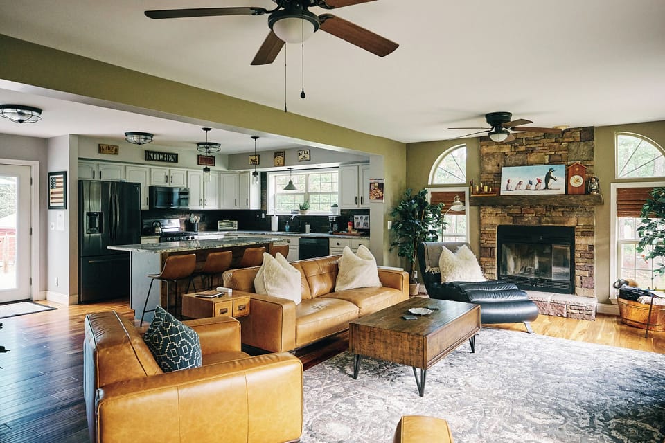 Open-concept great room combines living area and kitchen: a warm, inviting space