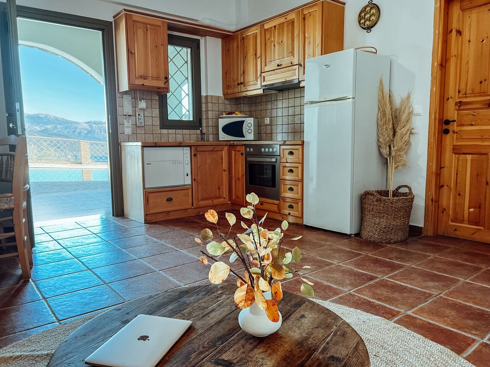 Aethra Apartment kitchen/dining area, view from living room, direct exit to pool
