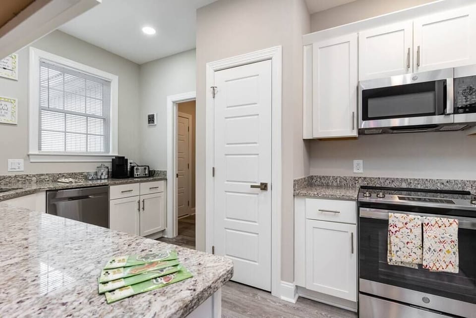 Beautiful modern fully equipped kitchen with brand new appliances and granite counters