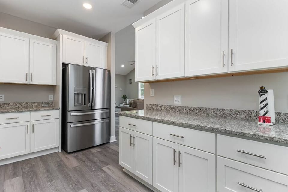 Beautiful modern fully equipped kitchen with brand new appliances and granite counters