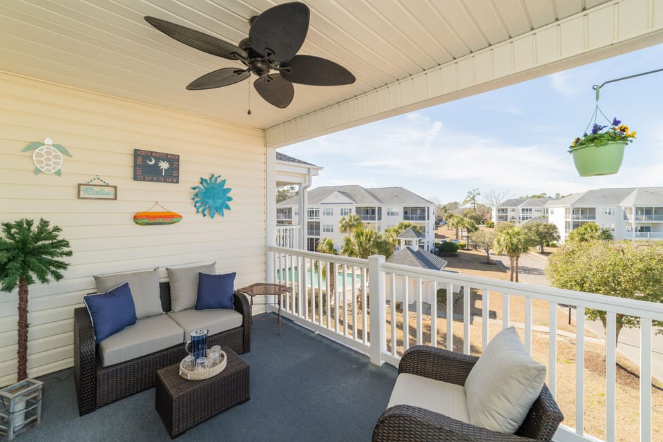 Porch that overlooks the pool and pond 