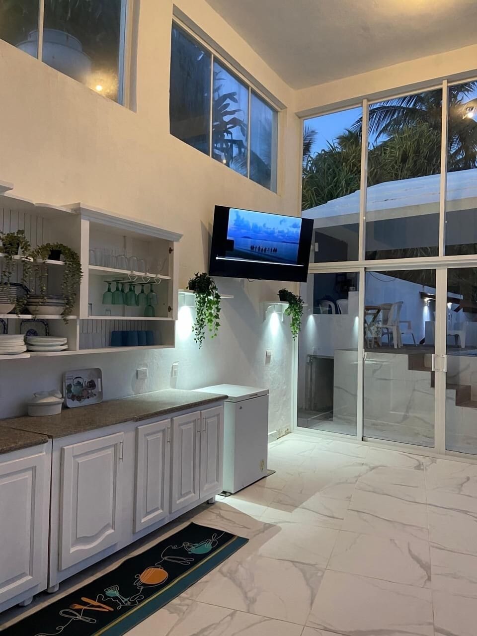 Open concept kitchen by the pool.