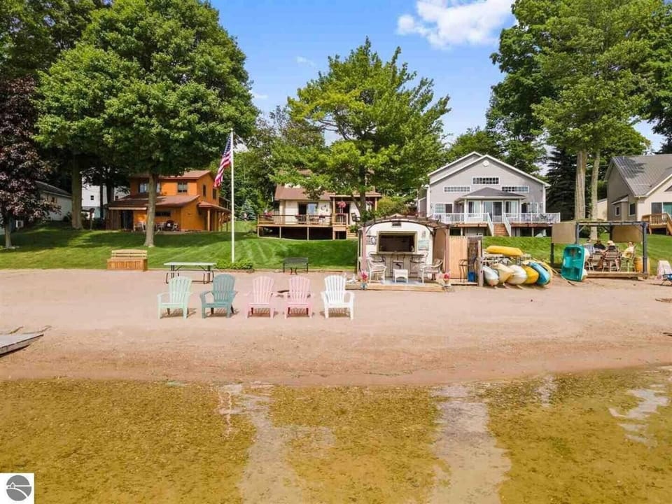 The beach has 50ft of private frontage just steps from the home, with a huge sandy beach for guests to enjoy.  It also has a fun Tiki Hut with bar seating, a refrigerator, and more.