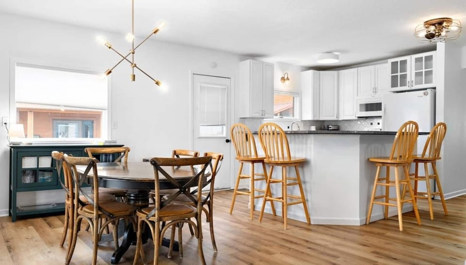 Walking through to the back of the home, you'll find a large open concept living area, featuring the kitchen, dining area, and second living room.