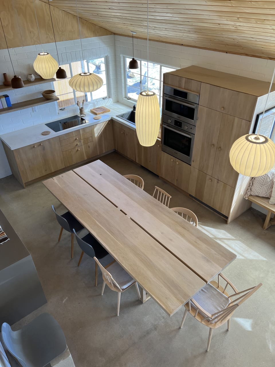 Kitchen with custom white oak 12 person table