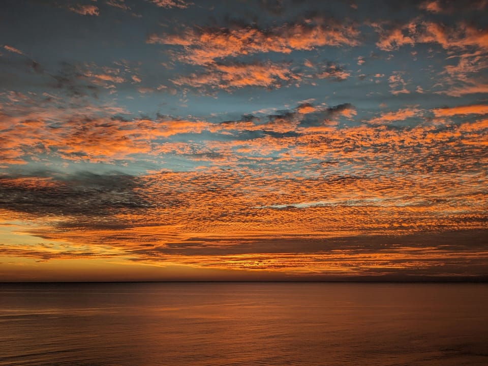 Beautiful sunsets from beach or balcony. And sometimes "moonsets" too!
