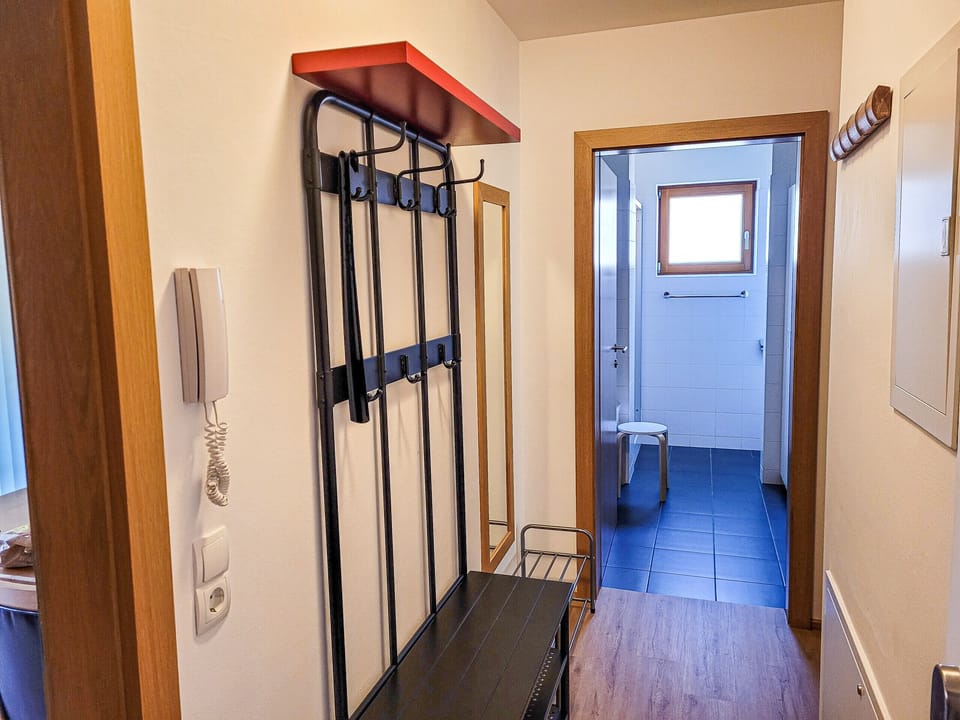 This is the entrance and hallway of the apartment. From here you can reach every room of the apartment. There is also plenty of space to store and put on your jackets and shoes.