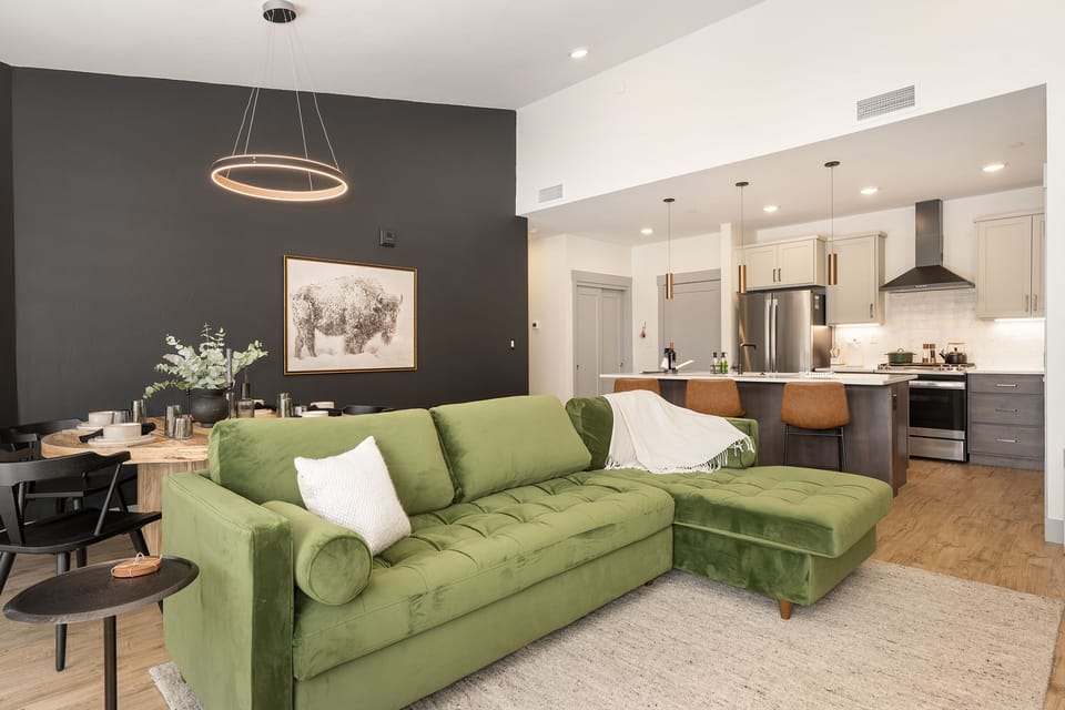 Open layout between dining area, living space, and kitchen.