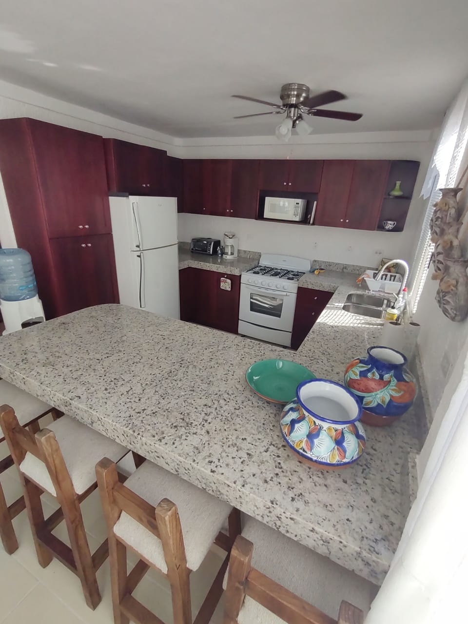 Fully appointed kitchen with breakfast bar.