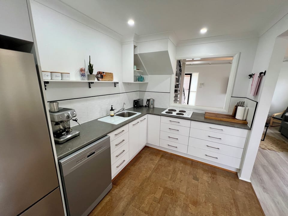 Kitchen included coffee machine.