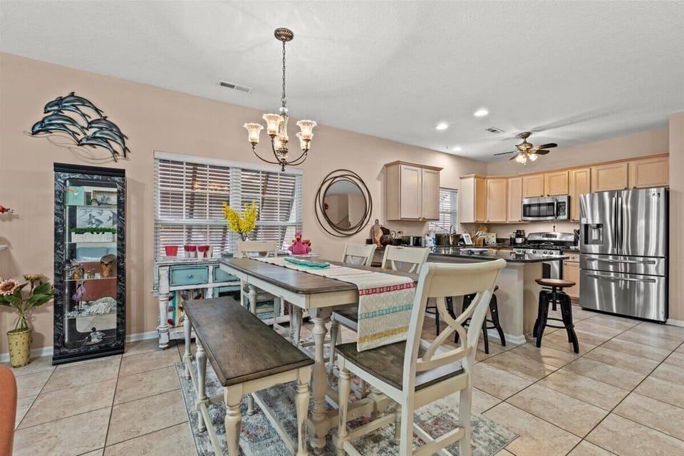 Your spacious kitchen flows seamlessly into the dining area, where you'll share memorable meals around the rustic farmhouse table.