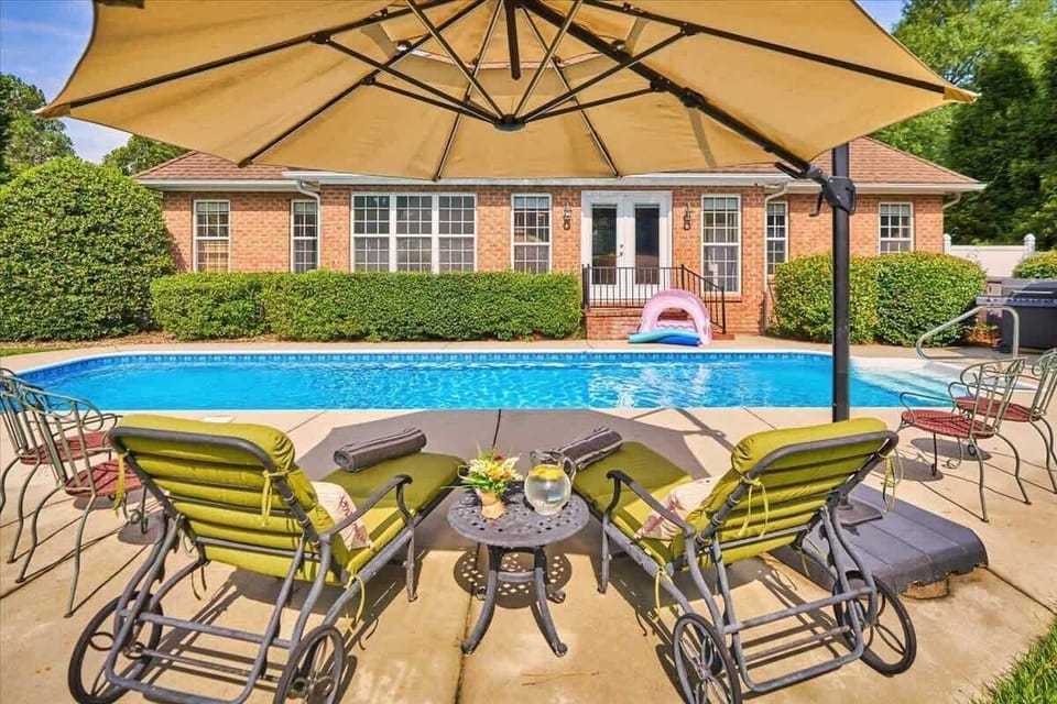 Relax and enjoy the pool with a cold beverage