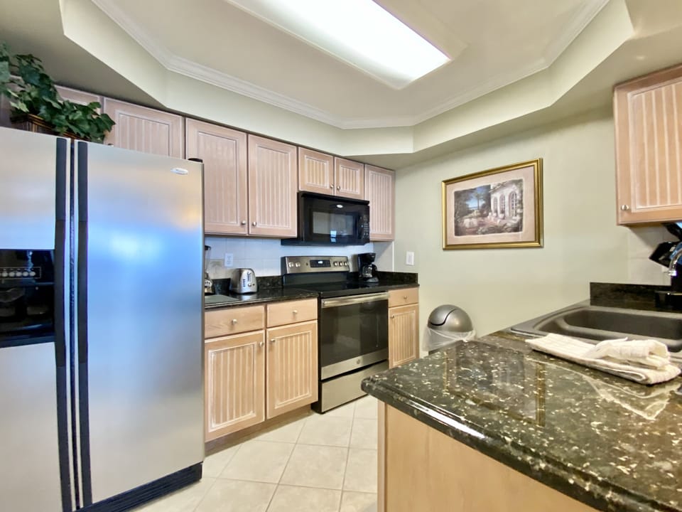 702 Remodeled Kitchen - Kitchen fully stocked! Everything you could need to cook in the condo