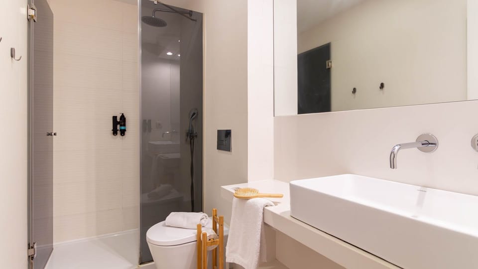 Refresh yourself in the sleek, modern bathroom featuring a spacious walk-in shower and contemporary design.
#Bathroom #WalkInShower #LovelyStay