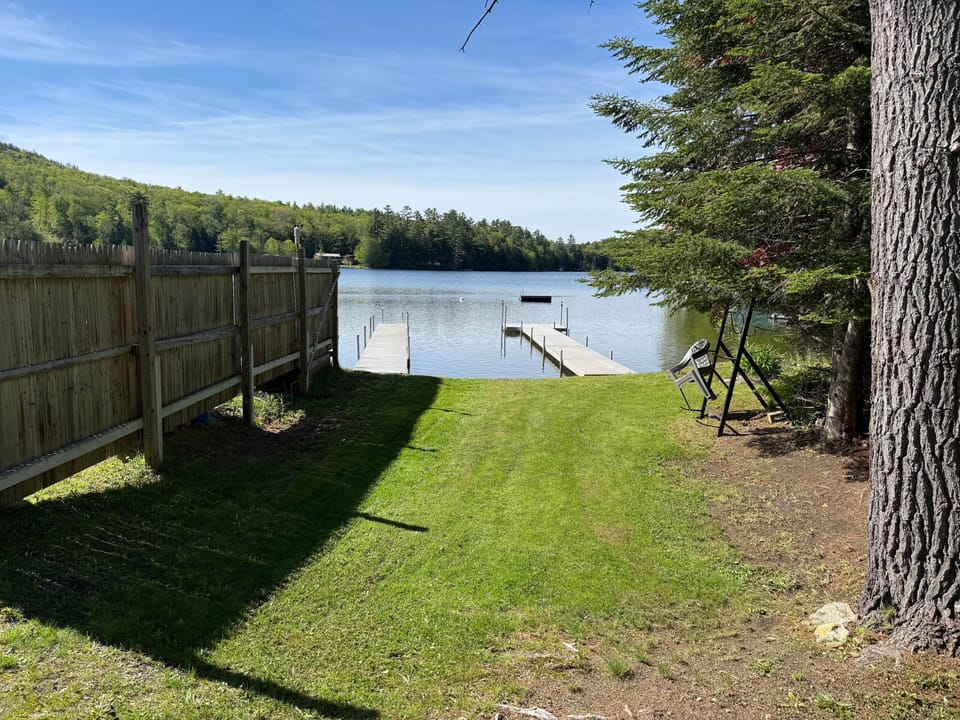 Level access to water. Shared dock on left.
