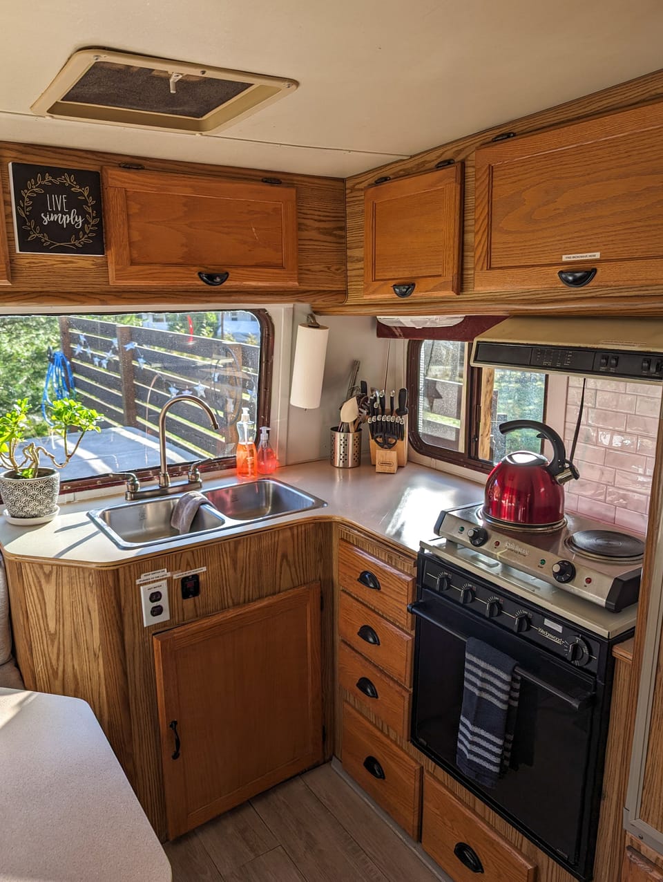 Kitchen is equipped with a 2 burner electric hot plate, microwave, and toaster. 