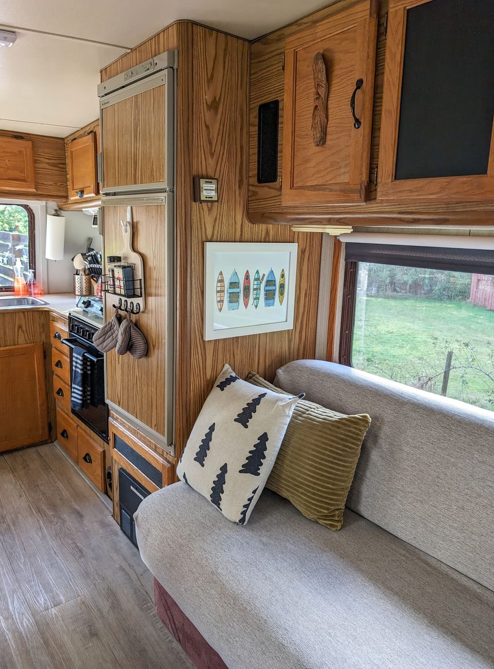 Bedding for pullout couch is kept in the cupboards above.