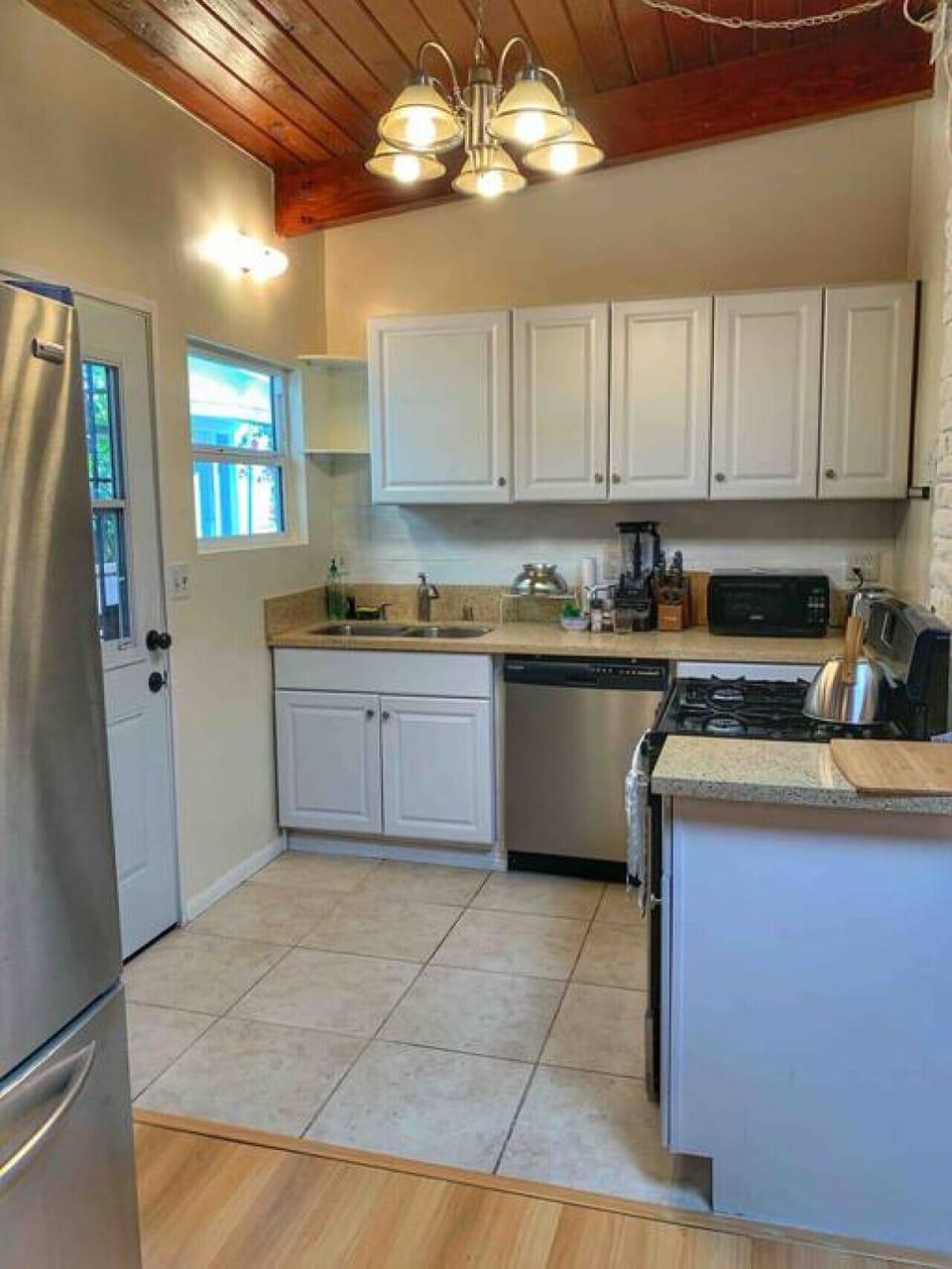 Bright kitchen with modern appliances and ample counter space.