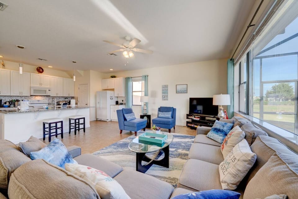 Open concept gathering area. 75" Smart TV (new photo to be updated soon). Enough seating for the entire family.  Sofa bed in the living area.  Fully equipped modern kitchen. Bright and spacious!