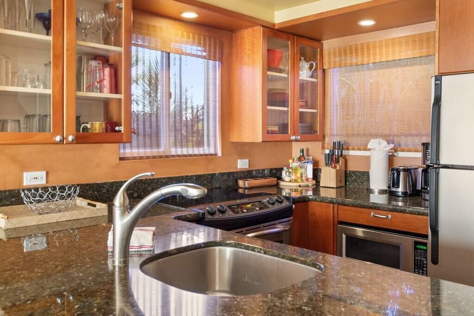 Kitchen with stainless steel refrigerator, stove/oven, microwave and dishwasher