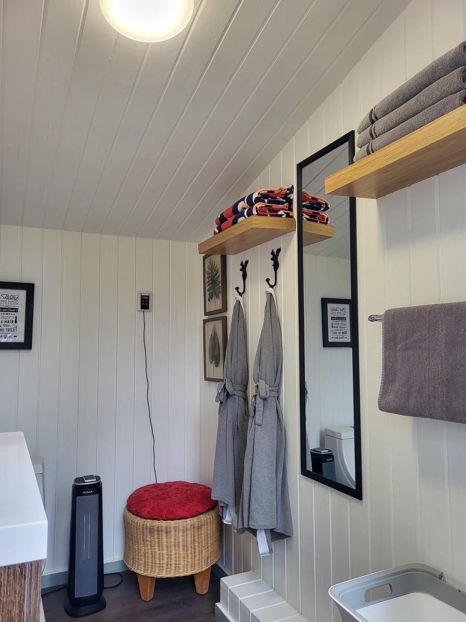 Robes and towels in Bathroom Cottage.