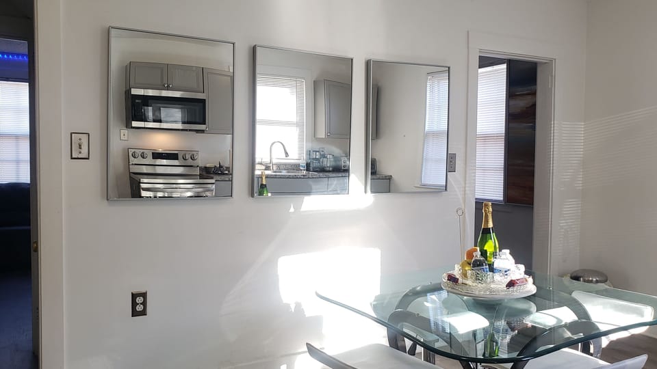 Dining/work  for 6 with low seating. Entrance to Living Room and Vestibule