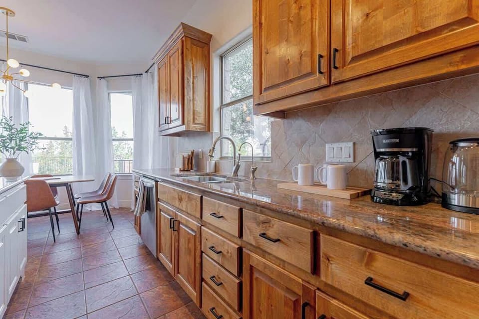 Home chefs will enjoy cooking in the modern kitchen with stainless steel appliances and plenty of counter space.