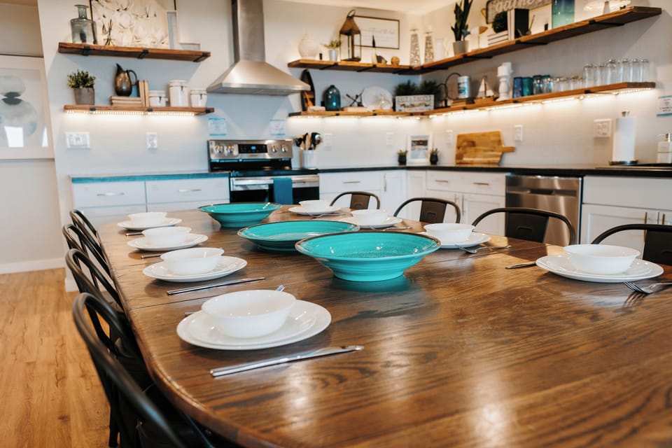 9 ft dining table seats eight guests with spare stools in the closet