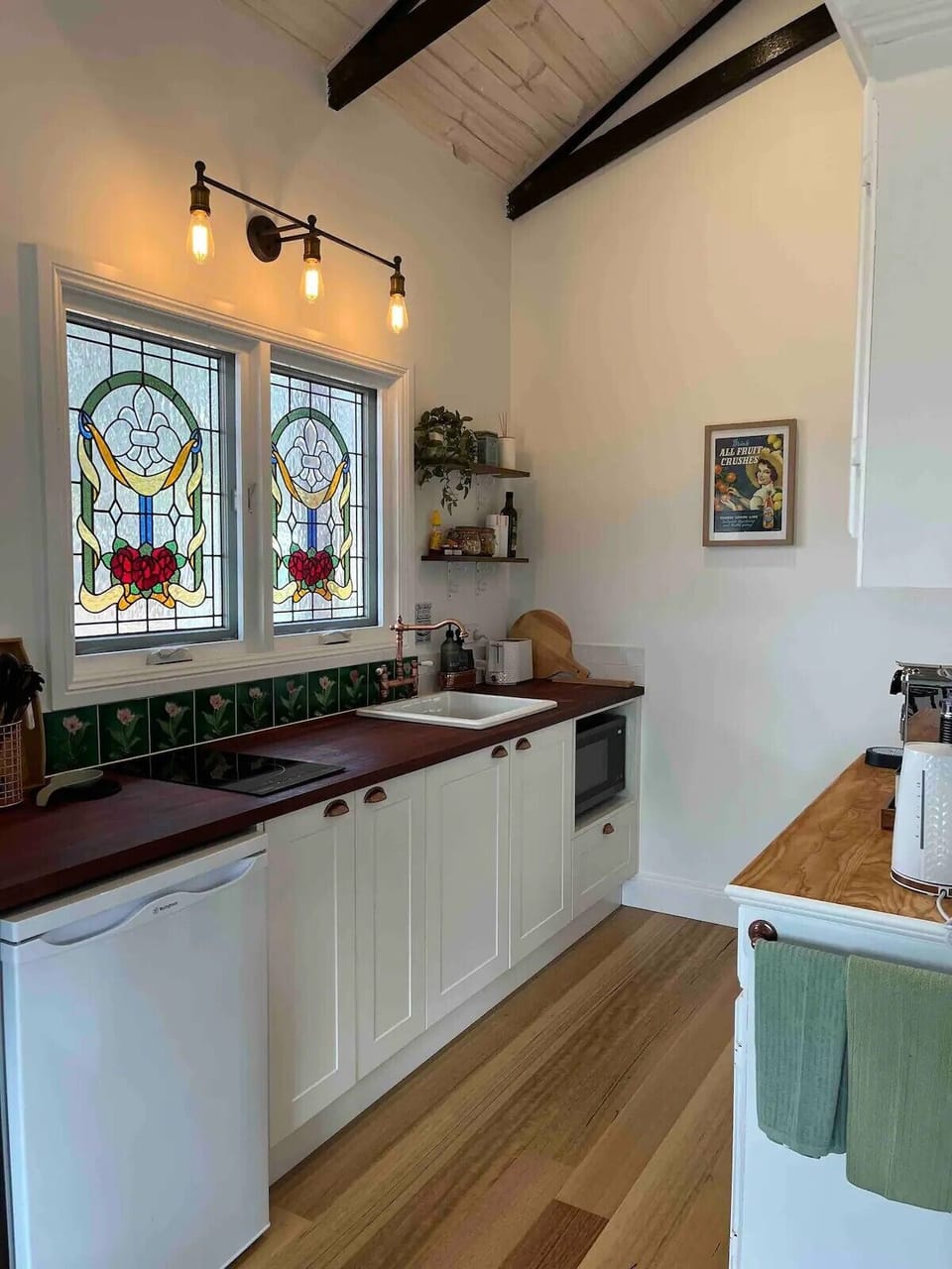 The kitchen with hotplates and microwave.