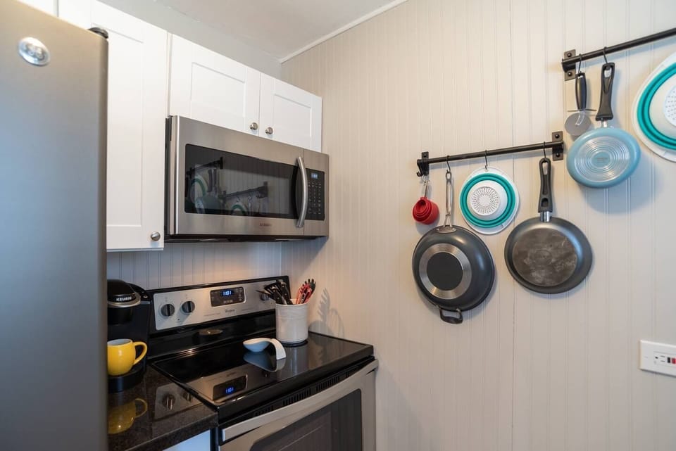 2 Coffee Makers. K-Cup and Standard,  Microwave - Pots and pans have been put in cabinets to keep sanitary