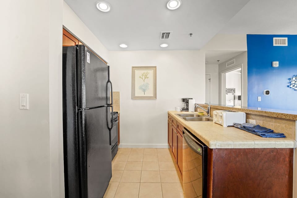 Kitchen: Refrigerator, Dishwasher, Sink, Coffee Maker, Toaster, Stove