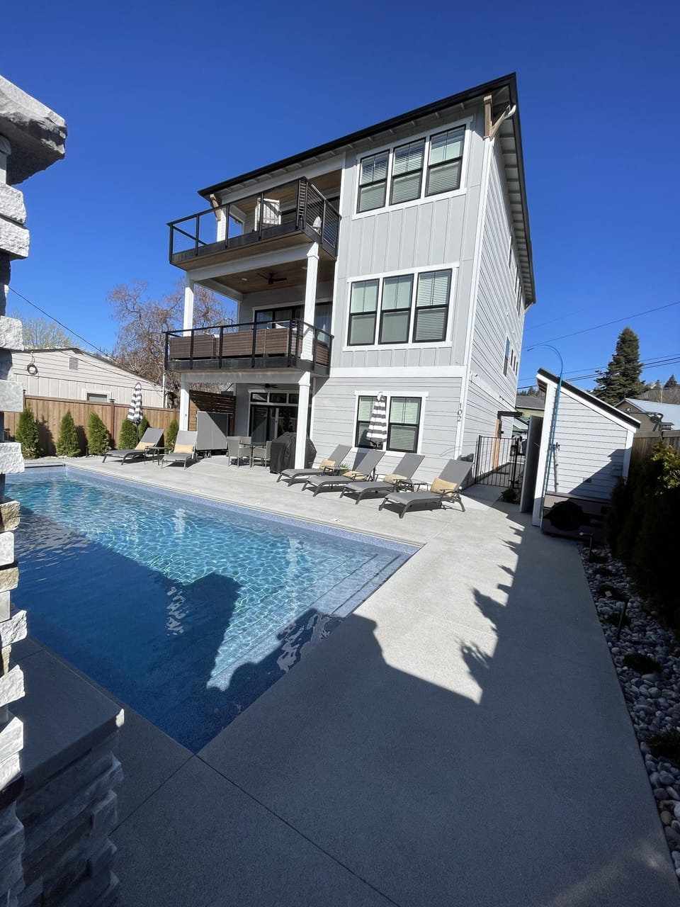 Front of the home as you enter the gate through stone columns off Harris Ave
