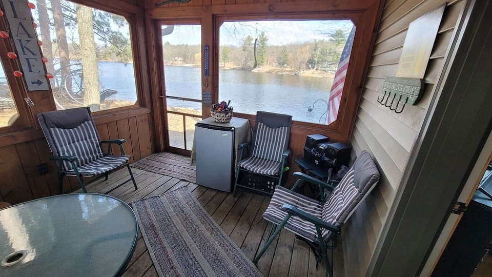 Screen porch over looks both Mt Morris lake and Emerald Lake.