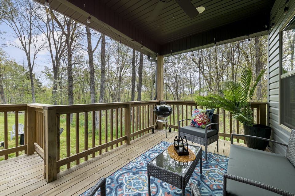 Enjoy our morning coffee on the back covered porch listing to nature