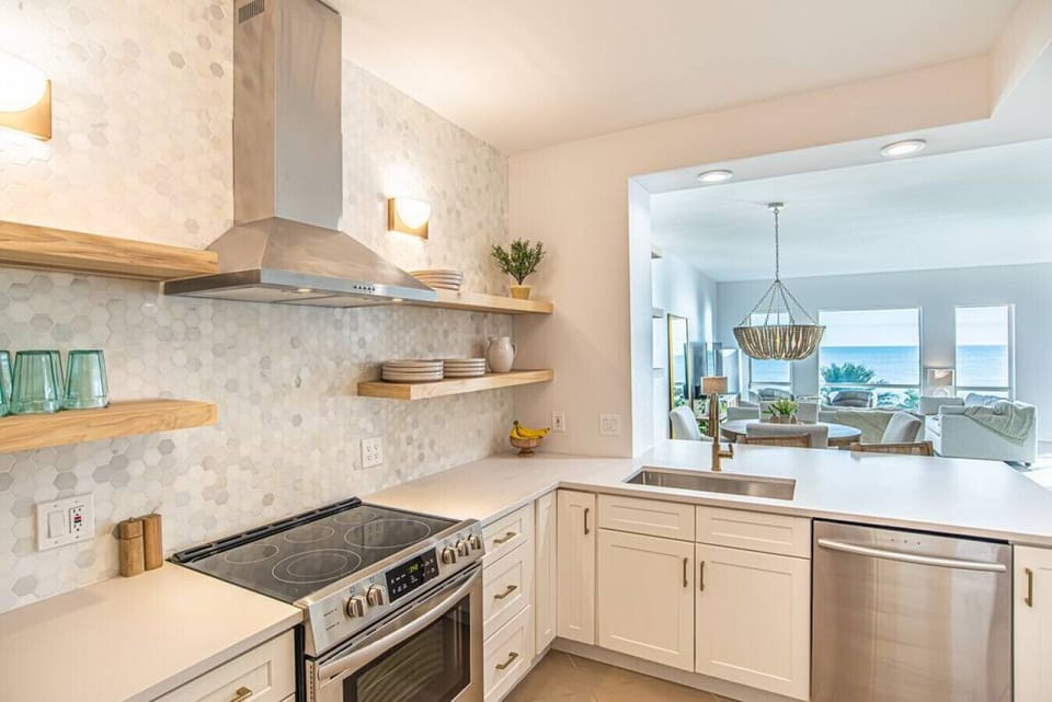 Kitchen with a full pantry and full-size washer and dryer combo.
