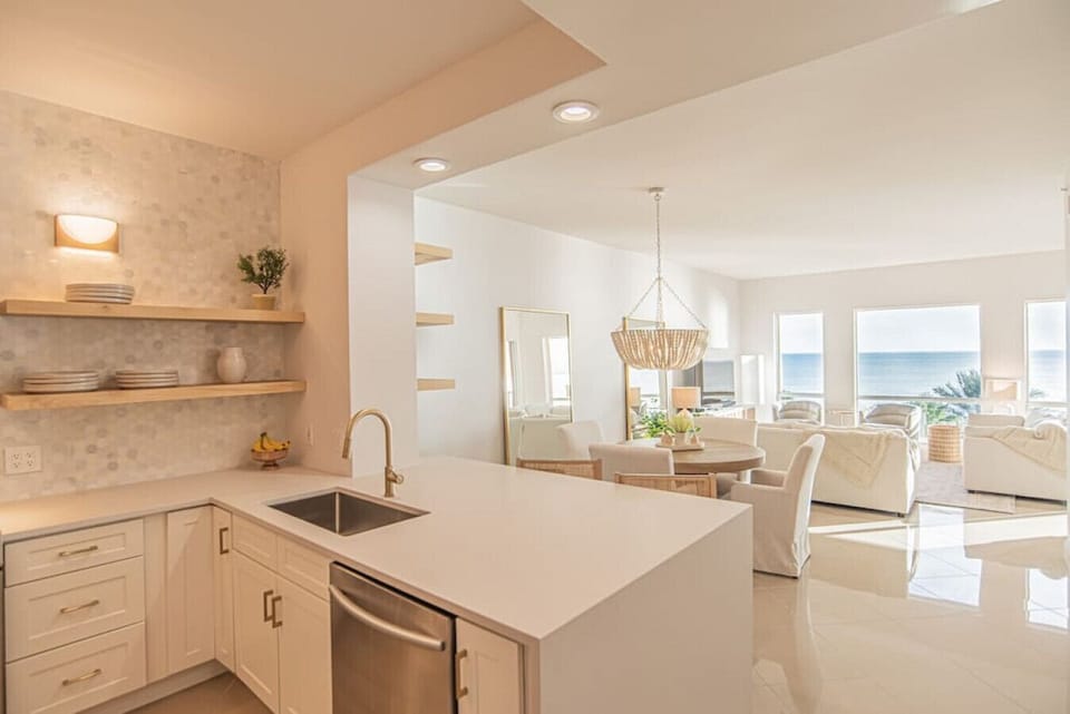 Kitchen, living, and dining in one open area.