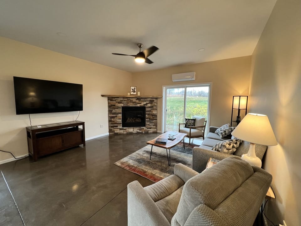 Relax with a fireplace and big screen TV.