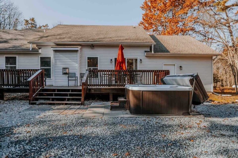 Backyard Deck with Hot Tub and Outdoor Lounge Area