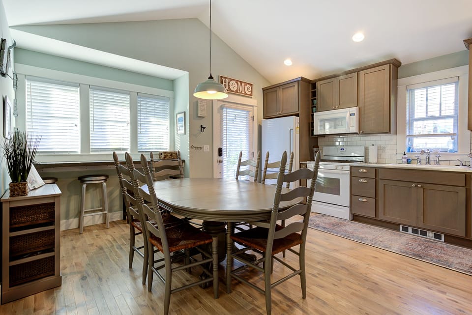 Centrally located dining table is the perfect place to gather