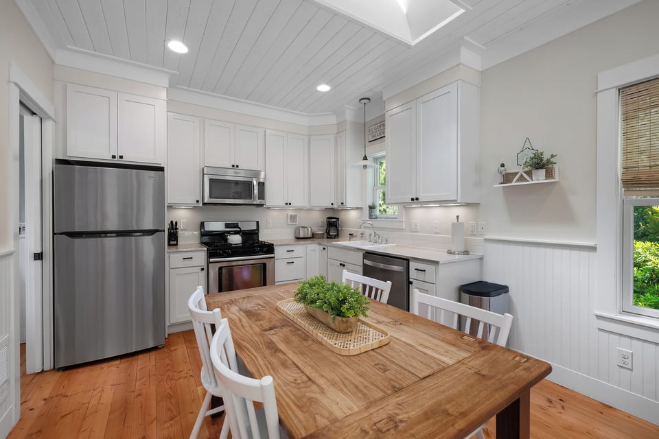 Open concept kitchen, living and dining spaces