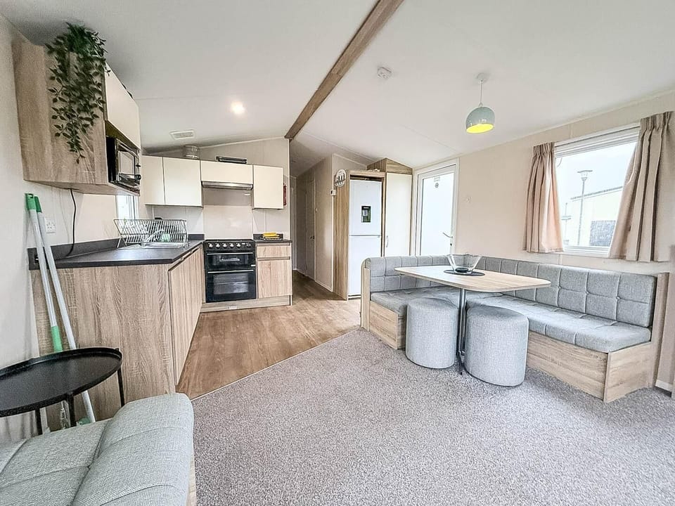 Relax in the kitchen area of your holiday home after a day of exploring.